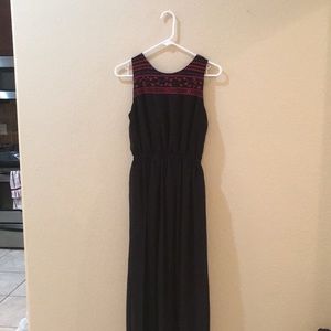 Long black cocktail dress with open back